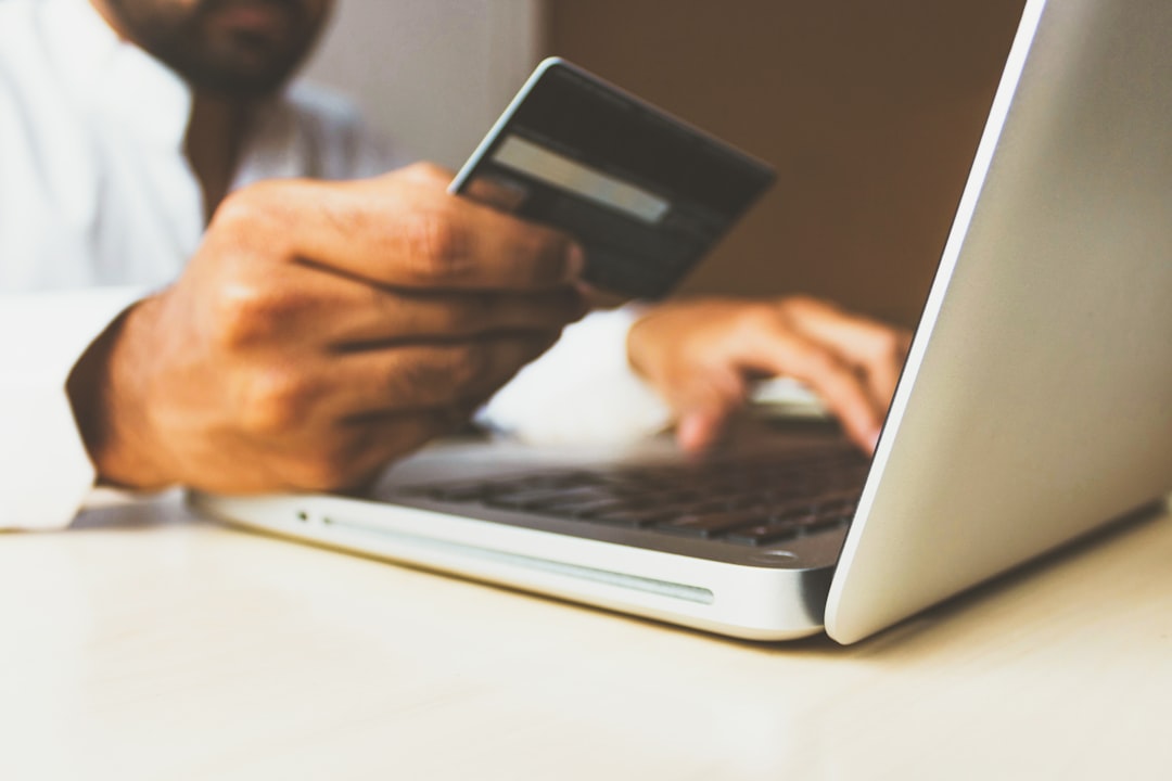 Business owner choosing an ecommerce payment gateway on a laptop